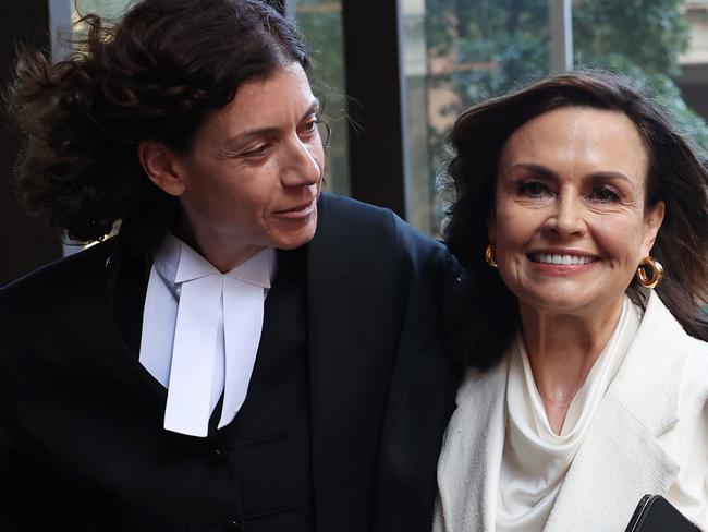 SYDNEY, AUSTRALIA - APRIL 15: Sue Chrysanthou SC hugs Lisa Wilkinson as they emerge from court on April 15, 2024 in Sydney, Australia. Justice Michael Lee is scheduled to hand down his verdict today in Bruce Lehrmann's defamation case against Network Ten and journalist Lisa Wilkinson. The case stems from allegations made by Brittany Higgins on 'The Project' news program that she was raped by a colleague in Parliament House. Lehrmann denied having any sexual contact with Ms Higgins and alleged he was defamed and identified by the broadcast, despite not being named. (Photo by Don Arnold/Getty Images)