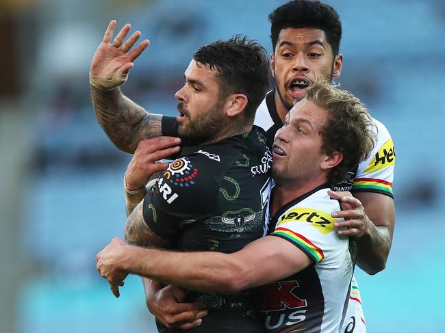 Rabbitohs Adam Reynolds is tackled by Panthers Matt Moylan during NRL match South Sydney Rabbitohs v Penrith Panthers at ANZ Stadium. Picture. Phil Hillyard