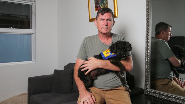 Craig Michaels with his puppy Jackson are living with Mould in his apartment in Summer Hill in Sydney. Picture: Daily Telegraph/ Gaye Gerard