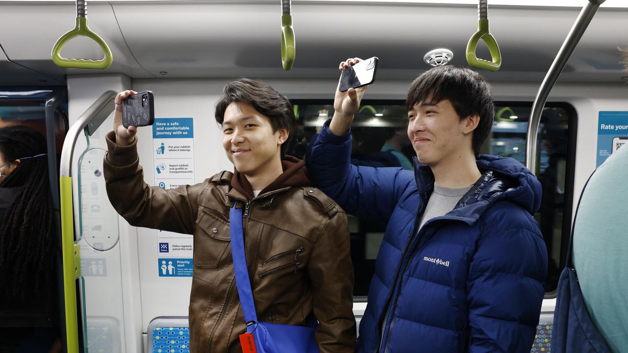 Pictured is Leo Player and Eason Wang who were among the first passengers who boarded at Sydenham Station on the brand new Sydney Metro on its maiden run to Tallawong at 4.54am. Picture: Richard Dobson