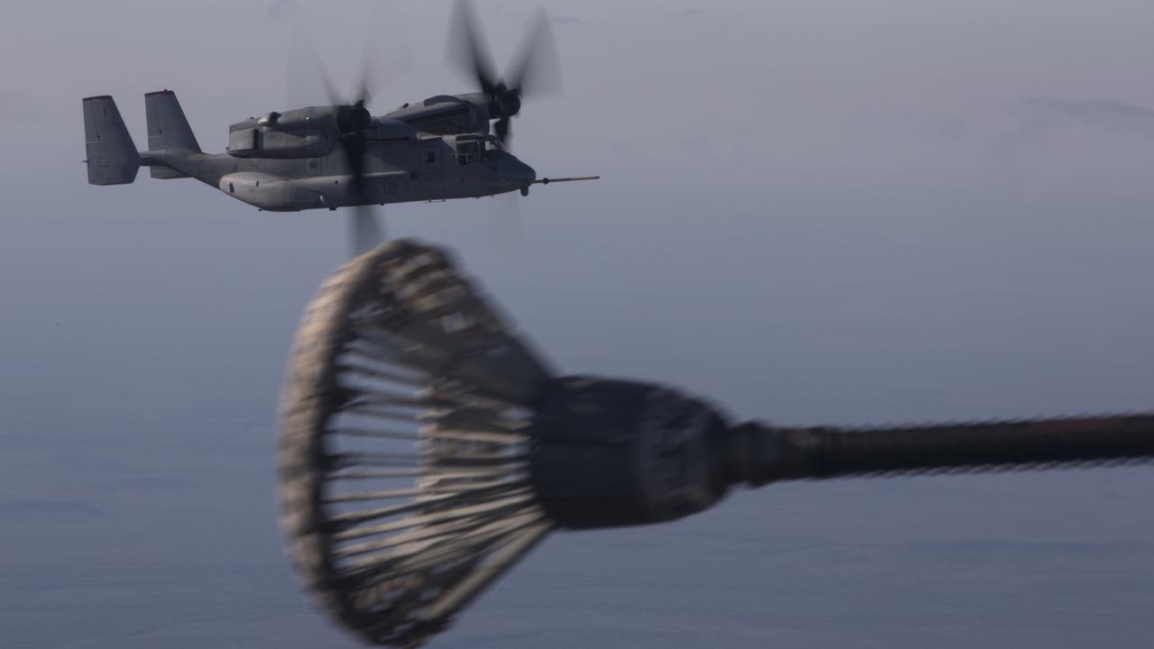 U.S. Marine Corps MV-22B Osprey aircraft with Marine Medium Tiltrodor Squadron 363, based out of Marine Corps Base Hawaii, prepare to conduct an aerial refueling with Marine Aerial Refueler Transport Squadron 152 in support of Exercise Talisman Sabre 21, Australia, July 13, 2021. TS21, the ninth iteration and conducted since 2005, occurs biennially across Northern Australia. Australian, US and other multinational partner forces use Talisman Sabre to enhance interoperability by training in complex, multi-domain operations scenarios that address the full range of Indo-Pacific security concerts. (U.S. Marine Corps photo by Cpl. Bryant Rodriguez)