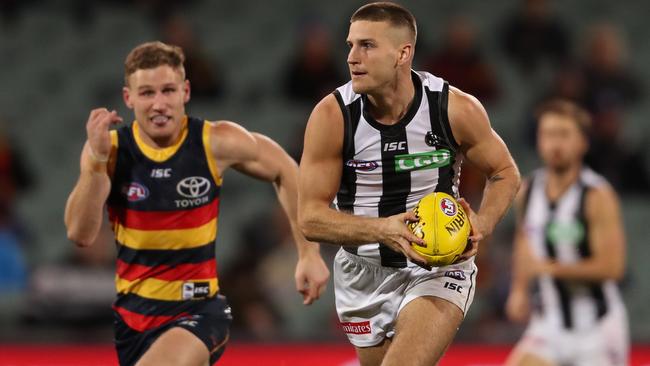 Adelaide’s Rory Laird chasing down Brayden Sier. Photo: Getty Images