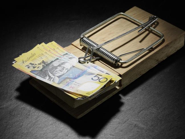 Australian dollars in a mouse trap, generic notes, cash.