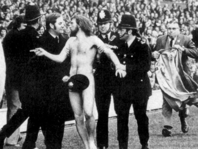 Michael O'Brien is caught after streaking at Twickenham in 1974. A police bobby found a novel use for his helmet.