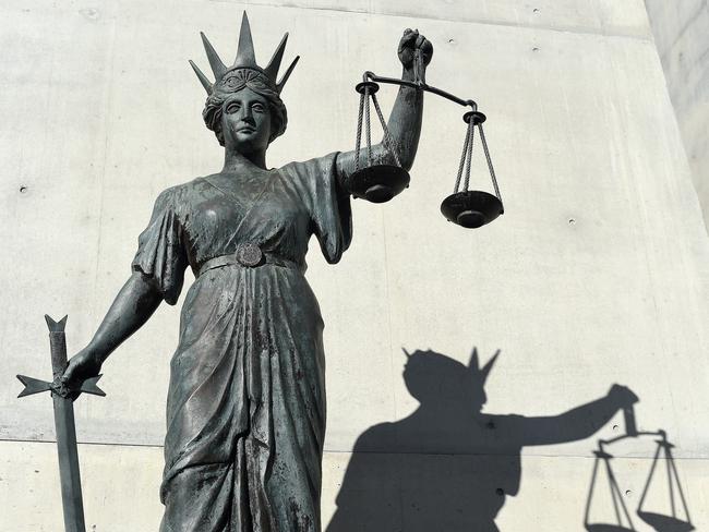 A statue of Themis, the Greek God of Justice stands outside the Supreme Court in Brisbane, Thursday, Oct. 20, 2016. (AAP Image/Dave Hunt) NO ARCHIVING