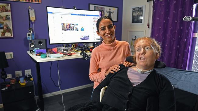 2Tracey Gibb, who has locked-in syndrome after suffering a stroke, with support staffer Taran Kaur. Picture: Tom Huntley