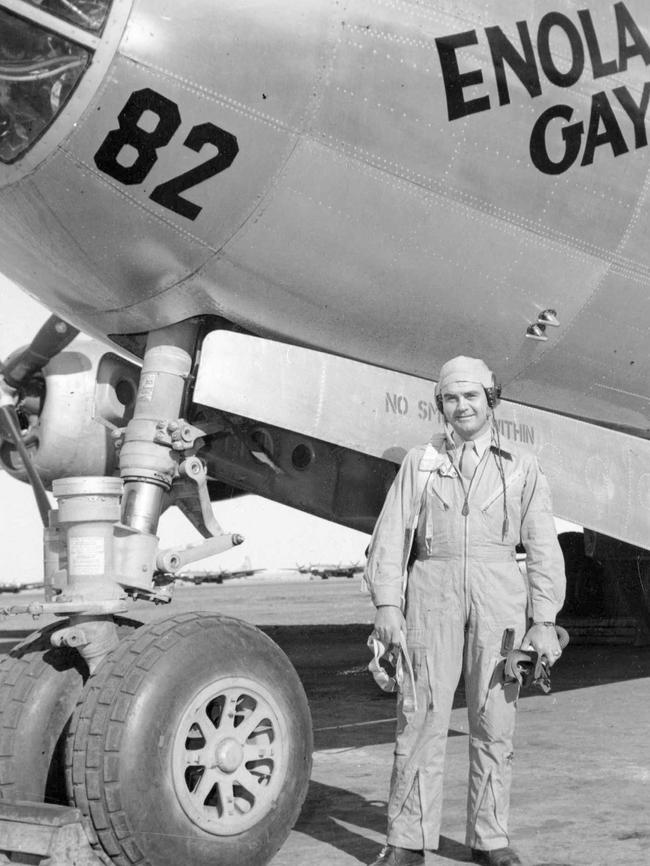 Col. Paul W. Tibbets stands beside the B-29 Superfortress bomber the Enola Gay in 1945. He piloted the flight which dropped the atomic bomb on Hiroshima. Picture: AP Photo