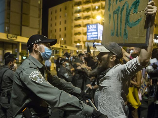 Protesters clash with police officers during a demonstration against Israeli Prime Minister Benjamin Netanyahu on September 20 in Jerusalem, Israel. Picture: Getty