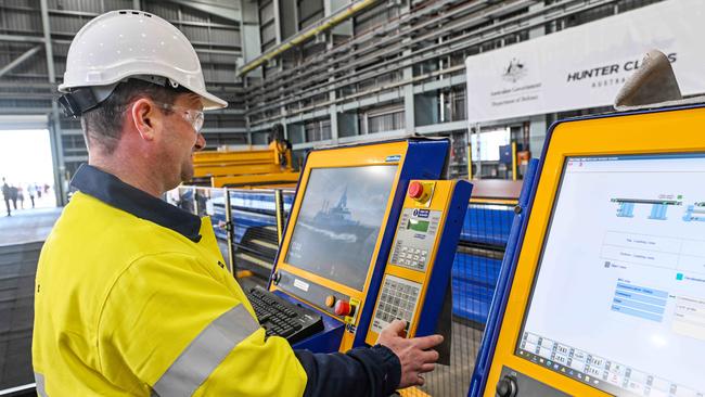 Boilermaker Scott Griffiths operates a plasma cutter to produce the first piece of steel to be used on the first Hunter class frigate to be constructed at the Osborne shipyard. Picture: NewsWire / Brenton Edwards