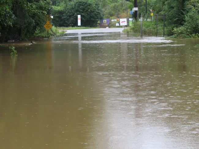 Burns Rd, Ourimbah, is still under more than 1m of water after torrential rains at the weekend. Picture: Richard Noone