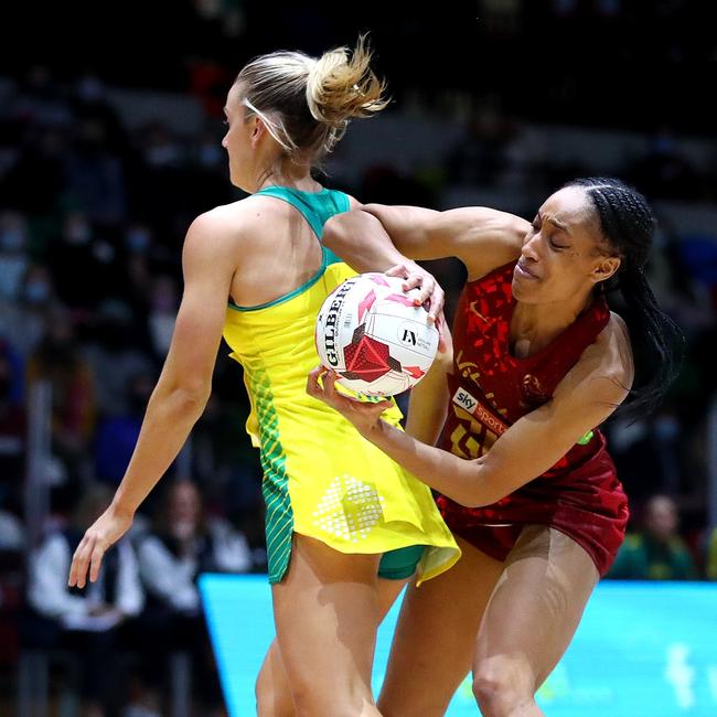 Layla Guscoth of Vitality Roses reaches around the back of Liz Watson of Australia. Picture: Chloe Knott/Getty Images for England Netball