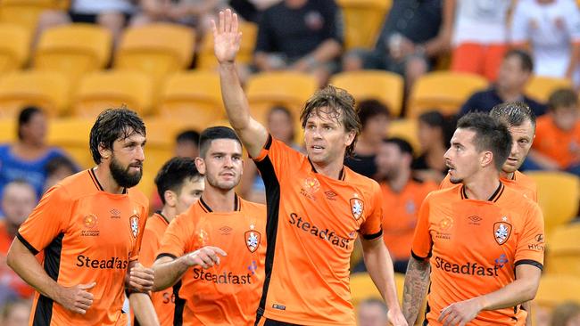 Brett Holman of the Roar with Thomas Broich and Jamie Maclaren.