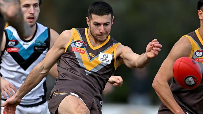 Michael Tabacco gets a kick for Thomastown. Picture: Andy Brownbill