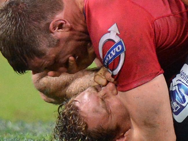 BRISBANE, AUSTRALIA - MAY 17: Ed O'Donoghue of the Reds and Scott Higginbotham of the Rebels are involved in an altercation during the round 14 Super Rugby match between the Reds and the Rebels at Suncorp Stadium on May 17, 2014 in Brisbane, Australia. (Photo by Bradley Kanaris/Getty Images)