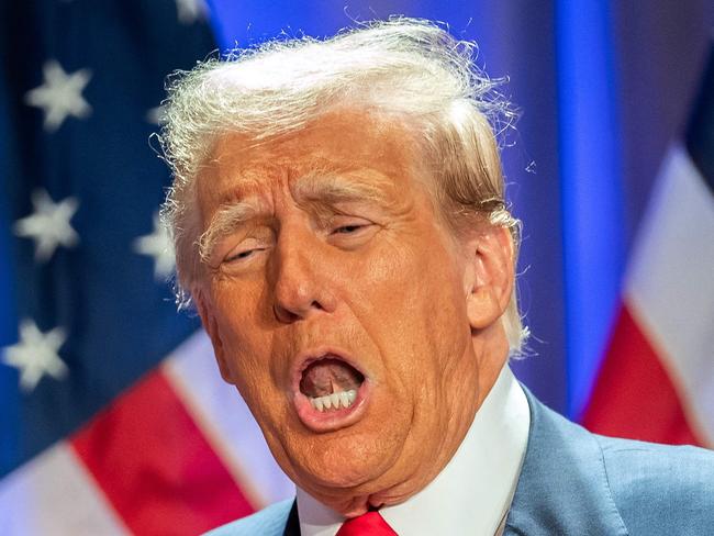 US President-elect Donald Trump gestures as he attends a meeting with House Republicans at the Hyatt Regency hotel in Washington, DC on November 13, 2024. (Photo by Allison ROBBERT / AFP)