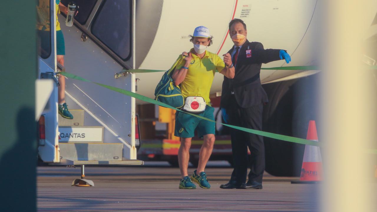 24 hours after the closing ceremony Australians Olympians arrive at Darwin International Airport en route to Howard Springs for 14 Days Quarantine. Picture: Glenn Campbell