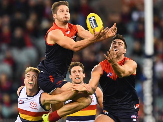 MELBOURNE, AUSTRALIA - JULY 03:  Jesse Hogan of the Demons attempts to mark over the top of Daniel Talia of the Crows  during the round 15 AFL match between the Melbourne Demons and the Adelaide Crows at Melbourne Cricket Ground on July 3, 2016 in Melbourne, Australia.  (Photo by Quinn Rooney/Getty Images)