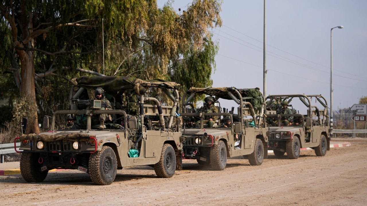 Israeli troops assemble on Gaza border for possible ground assault