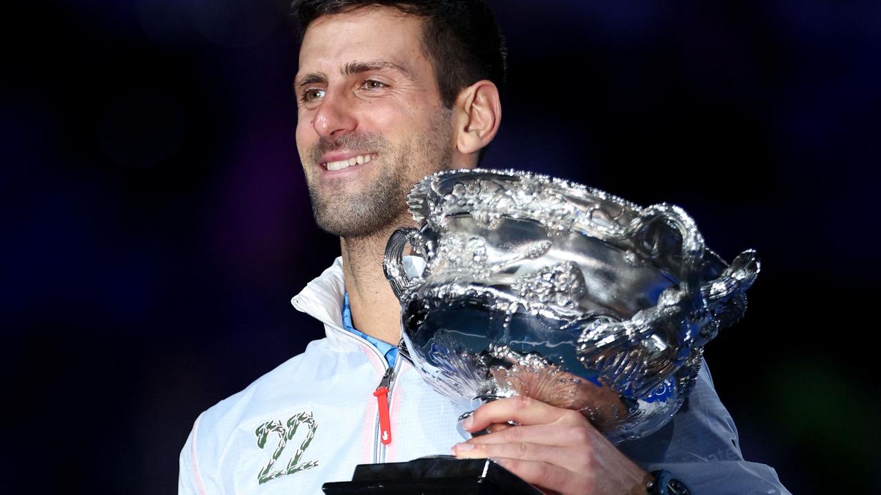 Novak Djokovic wearing the 22 jacket after his 10th Australian Open win. (Photo by Martin KEEP / AFP)