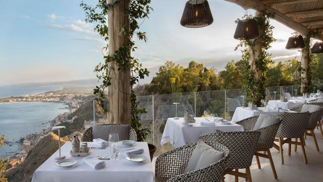 Guests dine with a view of the Ionian Sea.