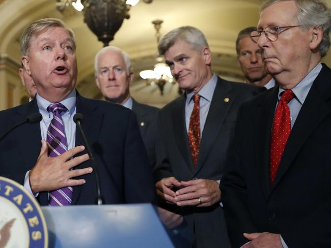 Senator Lindsey Graham, left, Senator Bill Cassidy, centre, and Senate Majority Leader Mitch McConnell, right. Picture: AP