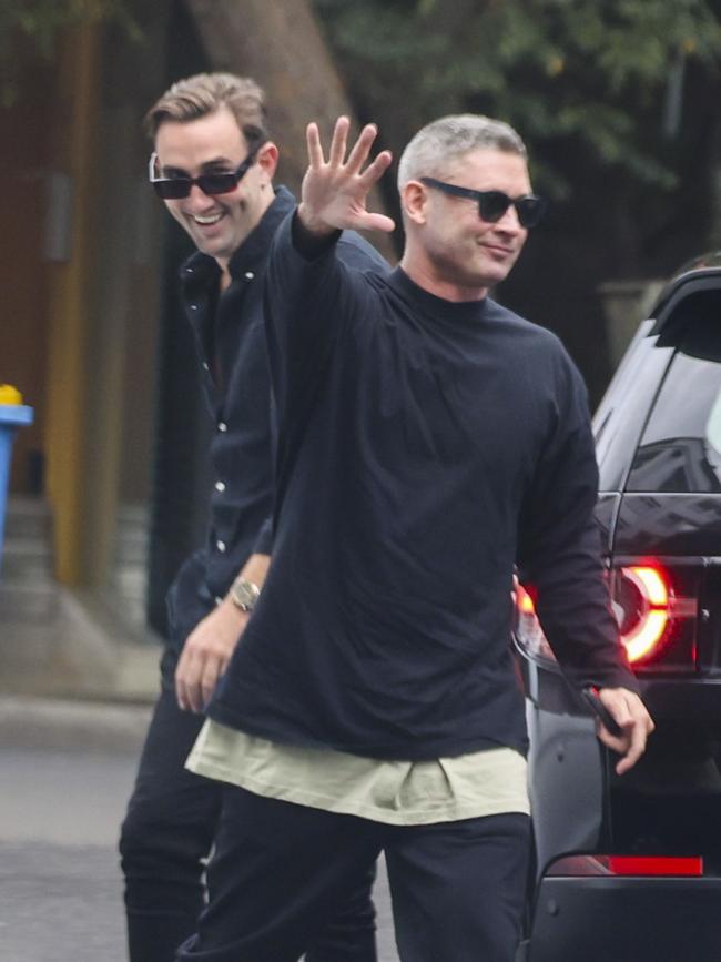 Michael Clarke with a friend going to the lunch. Photo: MEDIA MODE