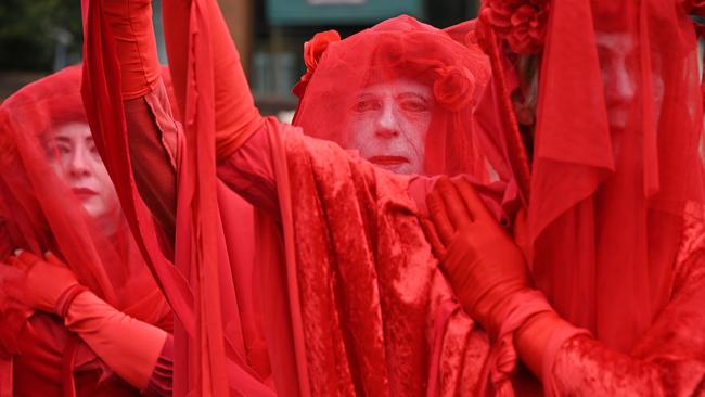 Extinction Rebellion activists stage a sit-in on a busy inner-city road. Picture: AFP