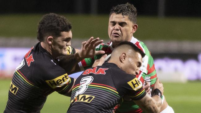 Latrell Mitchell of the Rabbitohs is tickled by Nathan Cleary and Dean Whare of the Panthers during the Round 7 NRL match between the Penrith Panthers and the South Sydney Rabbitohs at Netstrata Jubilee Stadium in Sydney, Thursday, June 25, 2020. (AAP Image/Craig Golding) NO ARCHIVING, EDITORIAL USE ONLY