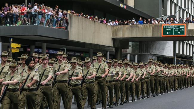 Thousands line Adelaide St in Brisbane for the 2023 Anzac Day March.