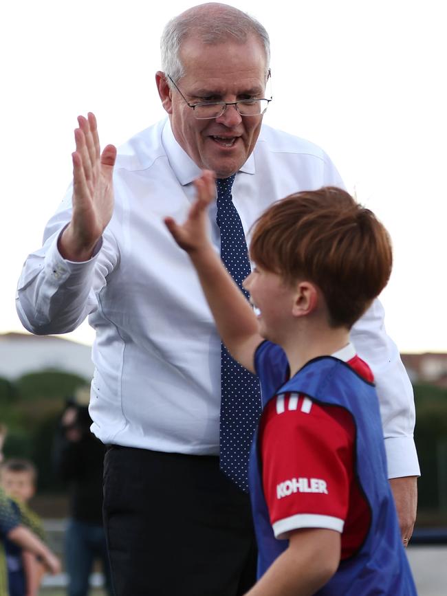 Everything’s OK – Luca high-fives the PM after the collision. Picture: Asanka Ratnayake/Getty