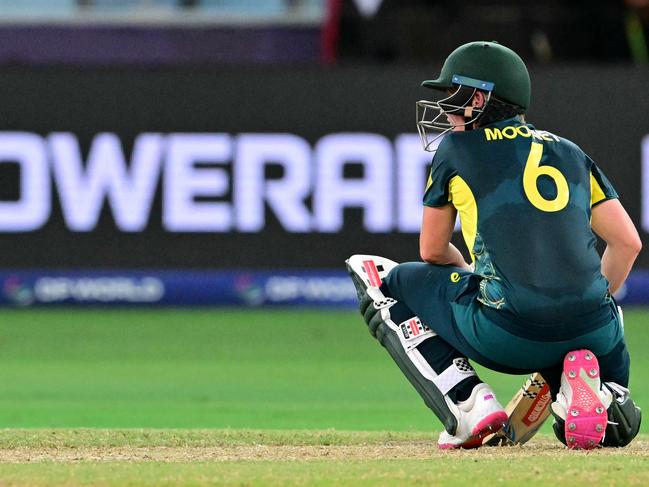 Australia's Beth Mooney reacts after her dismissal during the ICC Women's T20 World Cup cricket semi-final match between Australia and South Africa at the Dubai International Cricket Stadium in Dubai on October 17, 2024. (Photo by Giuseppe CACACE / AFP)