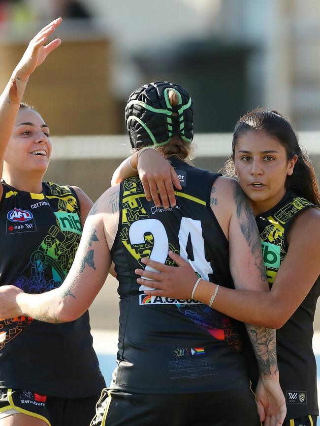 Emelia Yassir (right) celebrates with Tayla Stahl of the Tigers and Monique Conti.