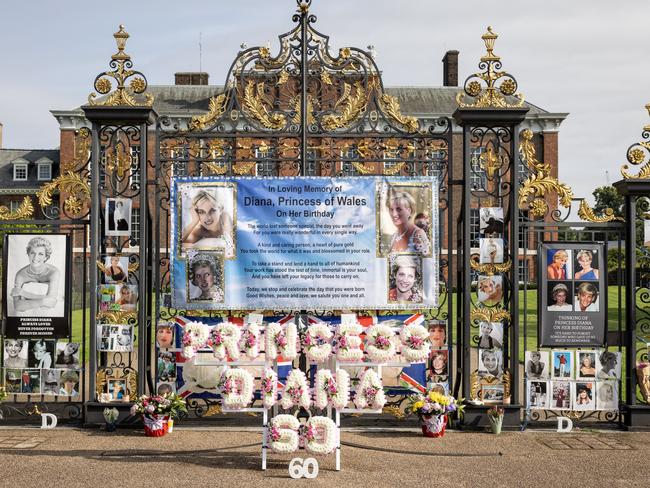 Flags, balloons and messages left by royal fans at Kensington Palace. Picture: Leon Neal