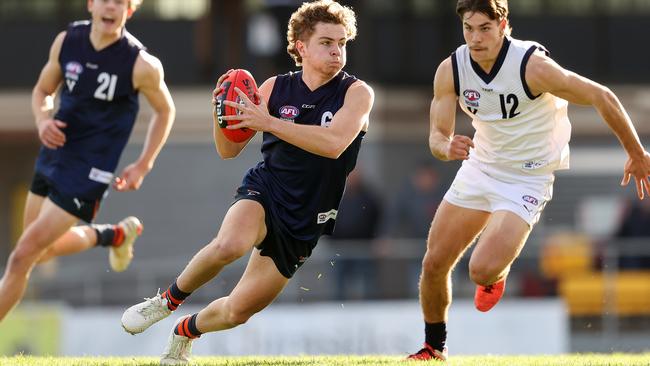 Zac Taylor in action for Vic Metro during the trial game against Vic Country.