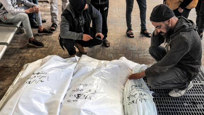 Relatives gather by the bodies of the Jabalieh family by Israeli bombardment on January 3, amid the ongoing conflict between Israel and Palestine. Picture: AFP