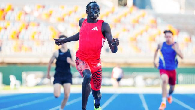 Gout Gout crosses the finish line on Sunday, changing his and his family’s life forever. (Photo by Patrick HAMILTON / AFP)