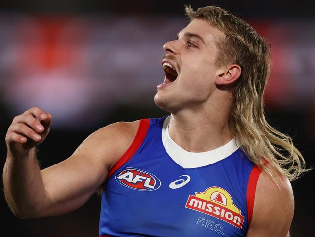 MELBOURNE, AUSTRALIA - July 21, 2023. AFL .        Bulldog Bailey Smith screams in frustration as his set shot on goal went out on the full during the round 19 match between Essendon and Western Bulldogs at Marvel Stadium on July 21, 2023, in Melbourne, Australia. Photo by Michael Klein.