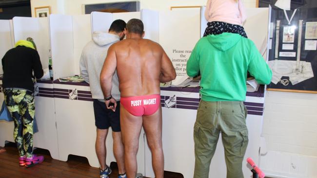 On election night the AEC only counts ‘ordinary votes’ from polling places, such as at the Bondi Surf Bathers Life Saving Club where it seems there is no official dress code. Picture: Kate Bastians