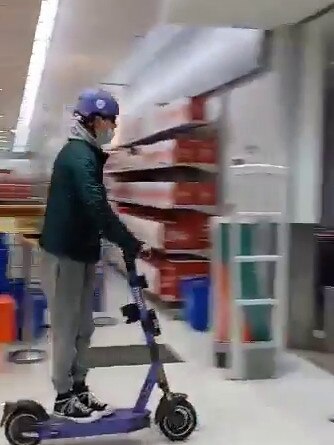 JOY RIDE: A young man rides an e-scooter through the New Town Plaza Kmart. Picture: Supplied.