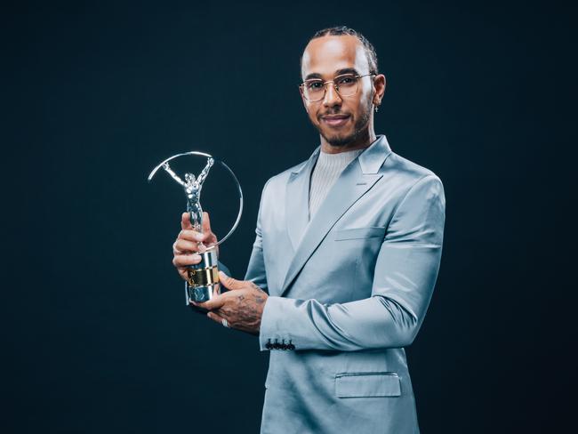 BERLIN, GERMANY - FEBRUARY 17:  Laureus World Sportsman of the Year winner Lewis Hamilton poses with his award during the 2020 Laureus World Sports Awards on February 17, 2020 in Berlin, Germany. (Photo by Simon Hofmann/Getty Images for Laureus)