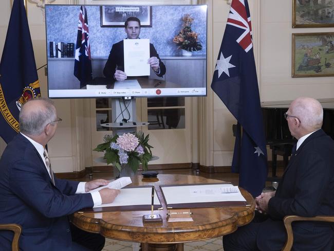 CANBERRA, AUSTRALIA-NCA NewsWire Photos DECEMBER 22 2020.SWEARING IN CEREMONYThe Prime Minister Scott Morrison with the Governor-General David Hurley during a swearing-in ceremony for Andrew Hastie at Government House, Canberra.Due to current COVID-19 restrictions, the ceremony was conducted via video conference. Each Minister joined via video conference to, in turn, take and sign the oath or affirmation of Office. Picture: NCA NewsWire / Gary Ramage