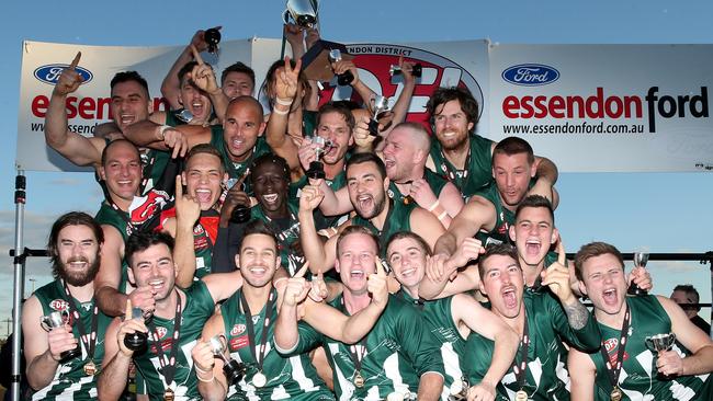 Airport West players celebrate the club’s 2018 Division 1 flag. Picture: Mark Dadswell