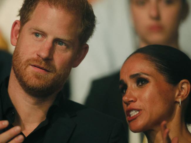 Harry, Duke of Sussex and patron of the Invictus Games (L), and his wife Meghan, Duchess of Sussex, attend the closing ceremony of the 2023 Invictus Games in Duesseldorf, western Germany on September 16, 2023. The Invictus Games, an international sports competition for wounded soldiers founded by British royal Prince Harry in 2014, was taking place from September 9 to 16, 2023 in Duesseldorf. (Photo by LEON KUEGELER / AFP)