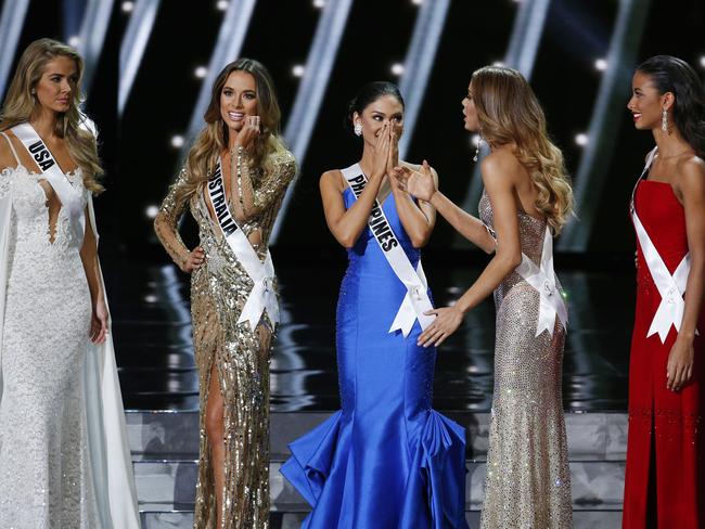 Tough choice ... the final five contestants on stage at the Miss Universe pageant. Picture: AP