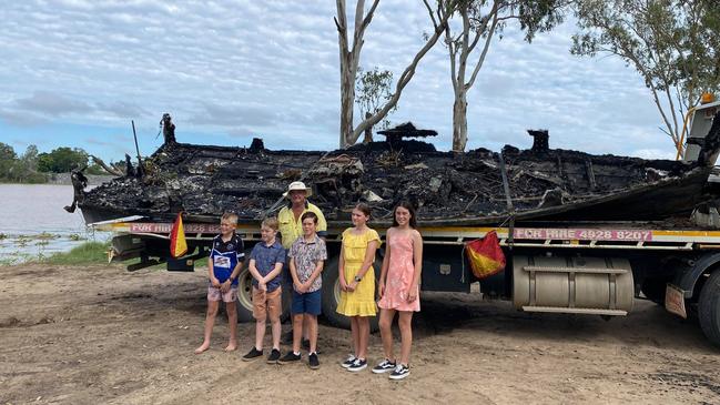 Mark Prosser's boat Old Dunn was destroyed in an arson attack on Friday April 9. Pictured with his grandchildren Xavier, Darius, Ari, Charlotte and Ainsley.