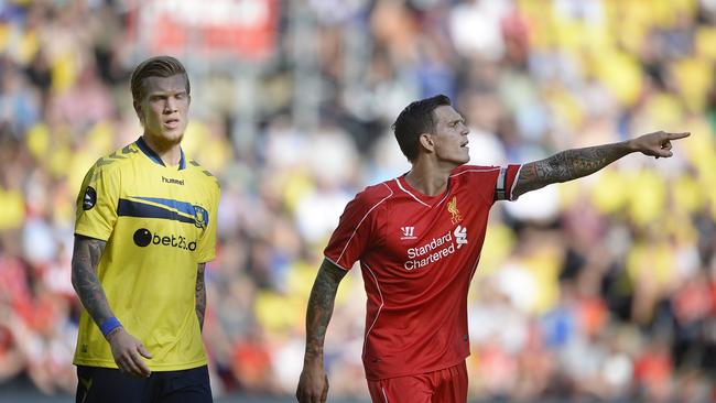 Simon Makienok of Brondby (L) and Daniel Agger of Liverpool walk on the pitch on July 16, 2014 at Broendby stadium suringa test match between Brondby and Liverpool. Broendby won 2-1. AFP Photo / / Scanpix DENMARK / Liselotte Sabroe / DENMARK OUT