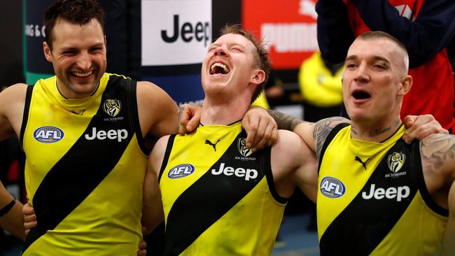 Toby Nankervis, Jack Riewoldt and Dustin Martin sing the team song.