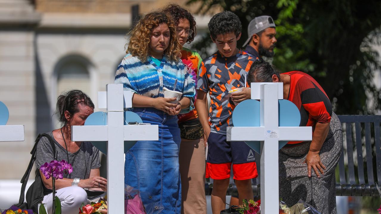 Mourners visit a memorial for a victims of Tuesday's mass shooting. Photo by Yasin Ozturk/Anadolu Agency via Getty Images