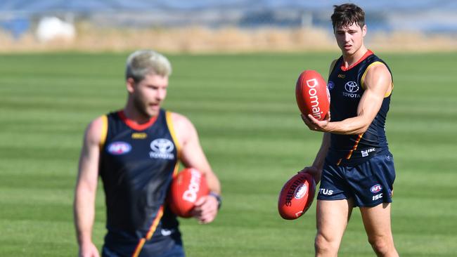 Luke Brown (back) and Bryce Gibbs during training last Monday. Picture: AAP Image/David Mariuz