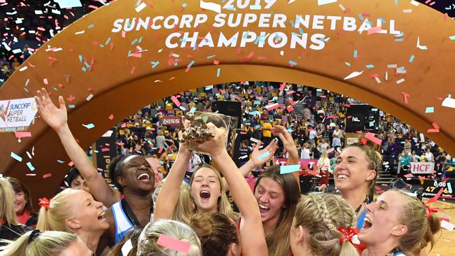 Swifts players celebrate winning the Super Netball decider last year.